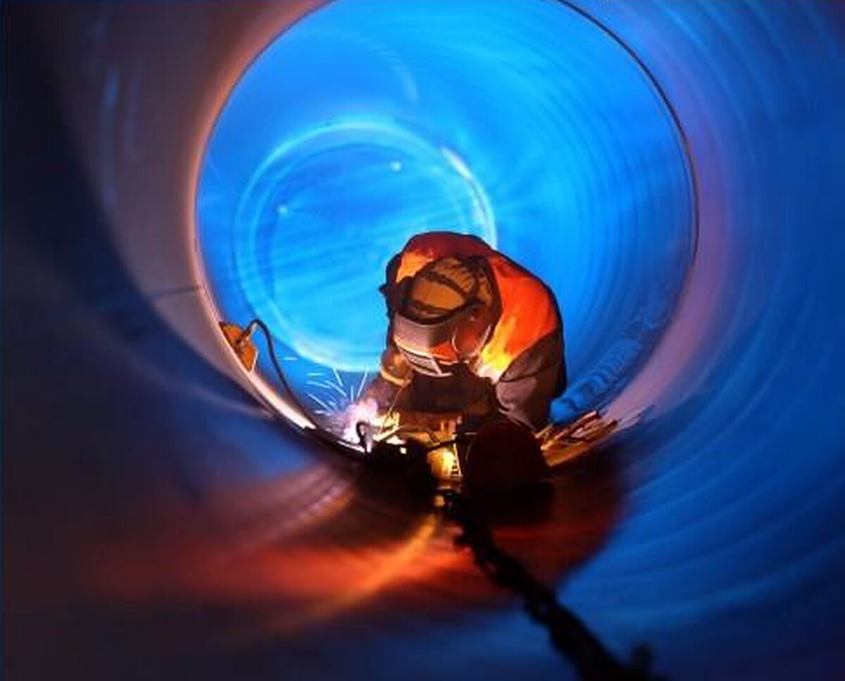 ATJ welder working inside a large-diameter pipe